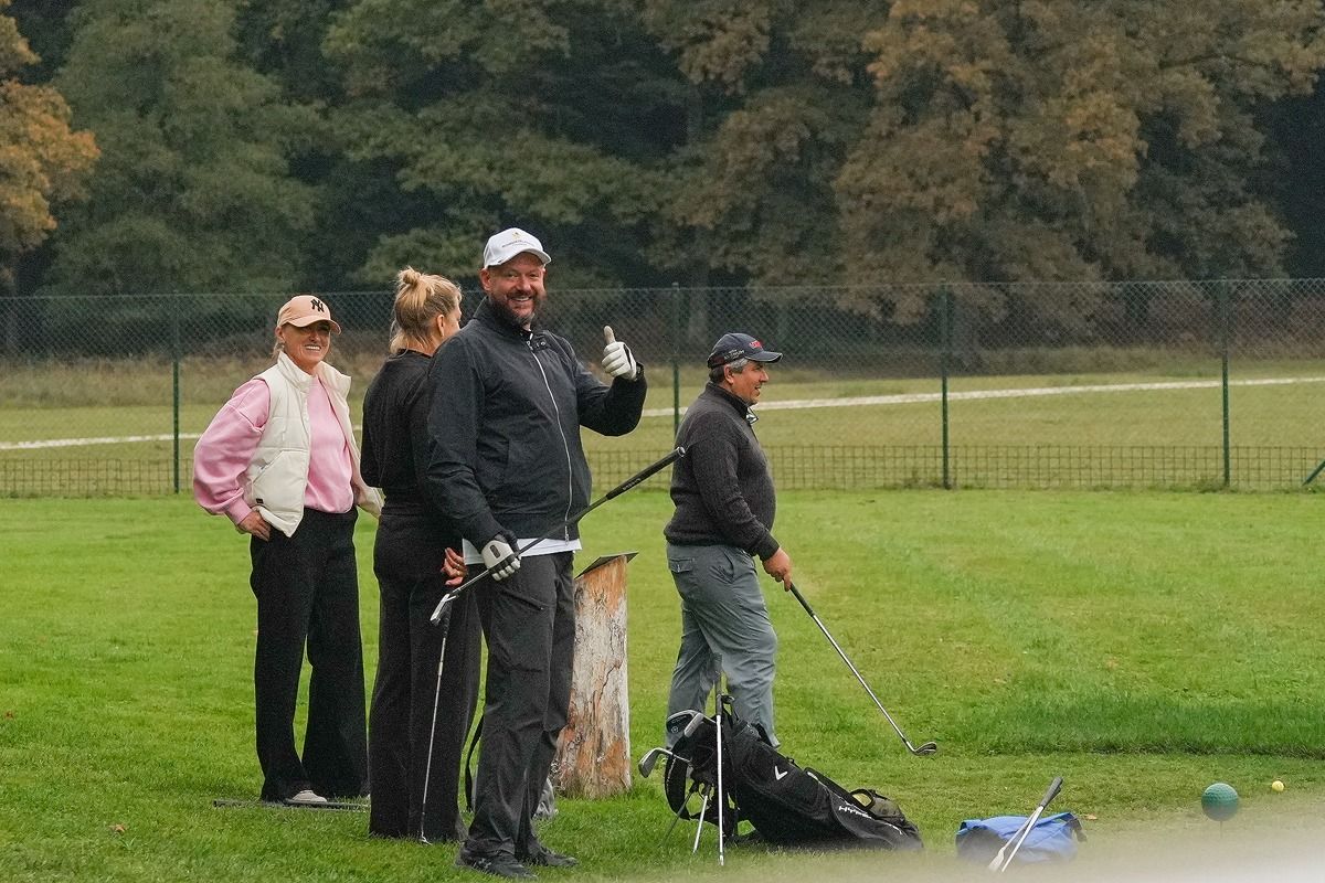 Players warming up on the practice range at Golf Brdo
